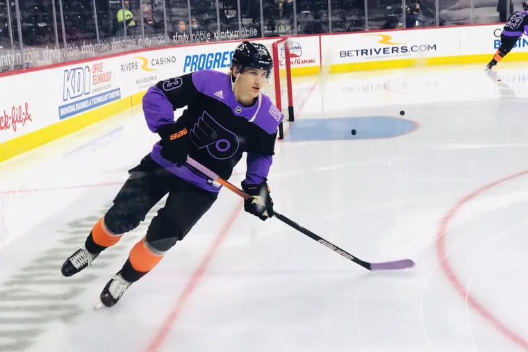 Flyers LW Oskar Lindblom does a solo lap on Hockey Fights Cancer Night Sunday at the Wells Fargo Center