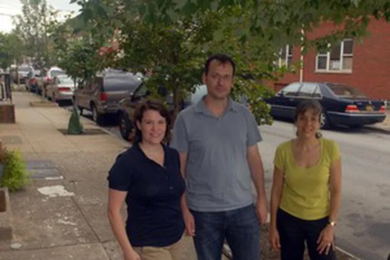 The Passyunk Square Civic Association&#0039;s Jackie Gusic (left), Geoff DiMasi and Susan Patrone with trees it helped plant. Patrone sees out-of-towners as &quot;new seeds for the grassroots.&quot;