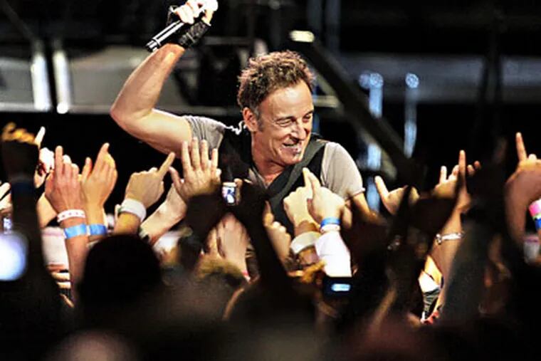 Bruce Springsteen performs during the last show of his four concert stand at the Spectrum last night. ( Elizabeth Robertson / Staff Photographer )