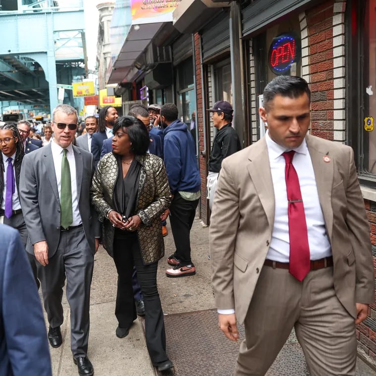 Mayor Cherelle L. Parker walks along Kensington Avenue with Managing Director Adam Thiel on Thursday, April 11, 2024. Thiel announced plans for an expanded shelter facility this week.