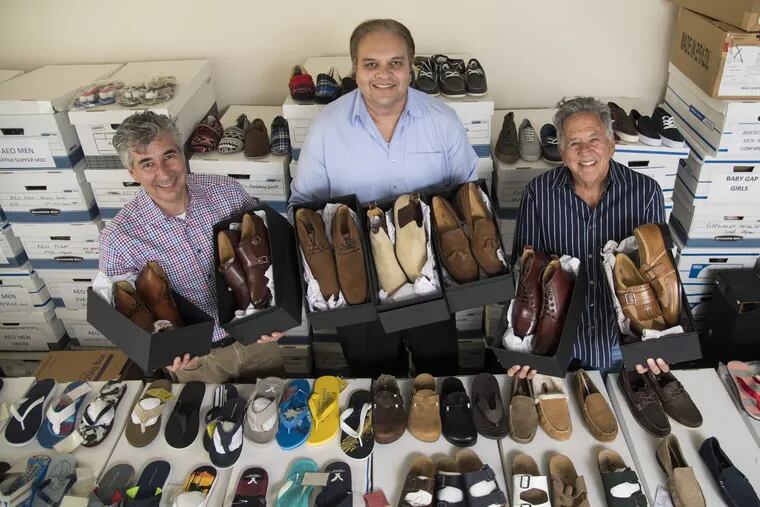 Titan Group/Chelsea Shoe Co. co-founders and partners (from left) Sandy Nydish, Bob Khan, and Bart Nydish, hold shoe boxes of their new label, Cobble &amp; Hyde, at the company’s West Norrtion headquarters June 1, 2017. The company has been a manufacturer of shoes for other private labels and this is their first foray into their own line of premium shoes. CLEM MURRAY / Staff Photographer