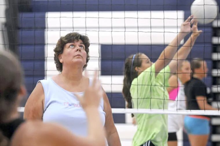 Shawnee High's Margaret Fanourgakis at volleyball tryouts. She teaches
physical education and health, advises the student council, and coaches. (Tom Gralish / Staff Photographer)