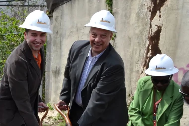 Jeffrey Allegretti (center) celebrates the groundbreaking of South Point, an affordable housing development in Point Breeze, in 2015.  Anthony Coratolo, from East Point Breeze Neighbors, is on the left.