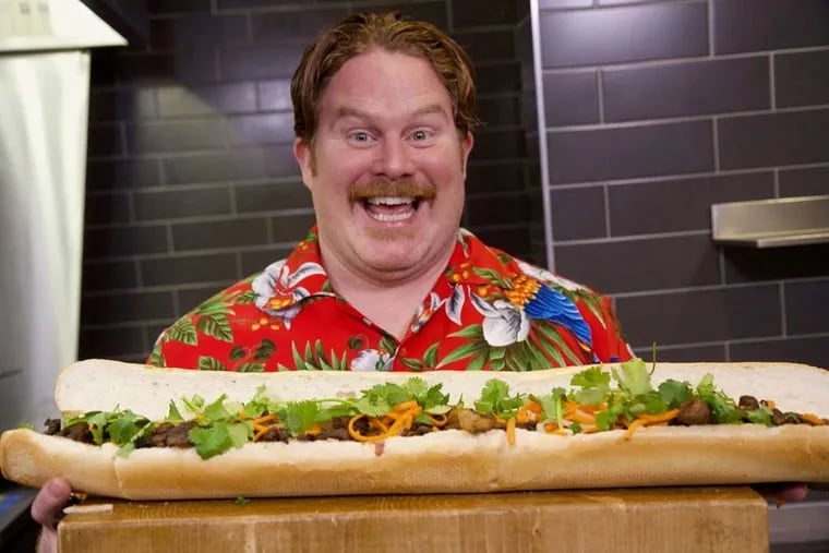 'Man v. Food' host Casey Webb with the bahn mi challenge from Lu’s Sandwich in Minneapolis.
