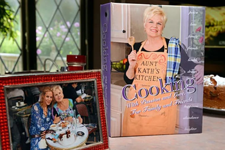 Kathy Bello's cookbook is seen next to a picture of her and her
daughter actress Maria Bello in the kitchen of her home. (Photo: Mark C Psoras)