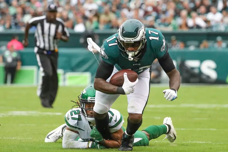 Eagles wide receiver Alshon Jeffery is brought down by New York Jets cornerback Darryl Roberts in the third quarter.