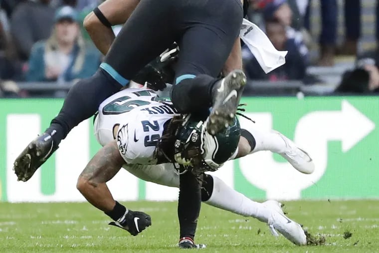 Eagles free safety Avonte Maddox stops Jacksonville Jaguars tight end David Grinnage at Wembley Stadium in London on Sunday, October 28, 2018. YONG KIM / Staff Photographer