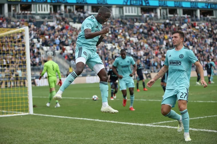 Union midfielder Jamiro Monteiro (35) celebrating a goal with defender Kai Wagner (27) during a game against the Montreal Impact last April.