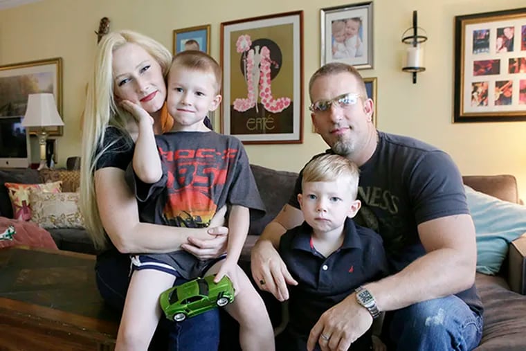 Tammy Mylo with sons TJ Mylo, 5, and Tyler Mylo, 3, and Steven O'Donnell in their Cherry Hill home on September 11, 2014.  ( ELIZABETH ROBERTSON / Staff Photographer )