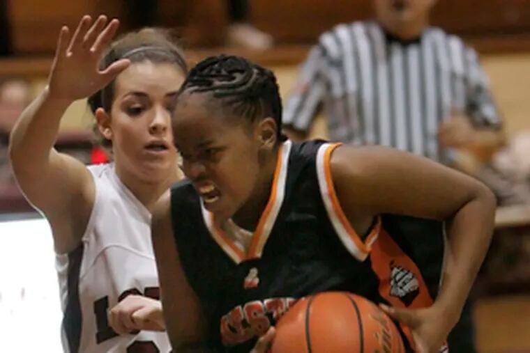 Chester&#0039;s Shakira Showell drives on Lower Merion&#0039;s Erin Knox during a playoff game.