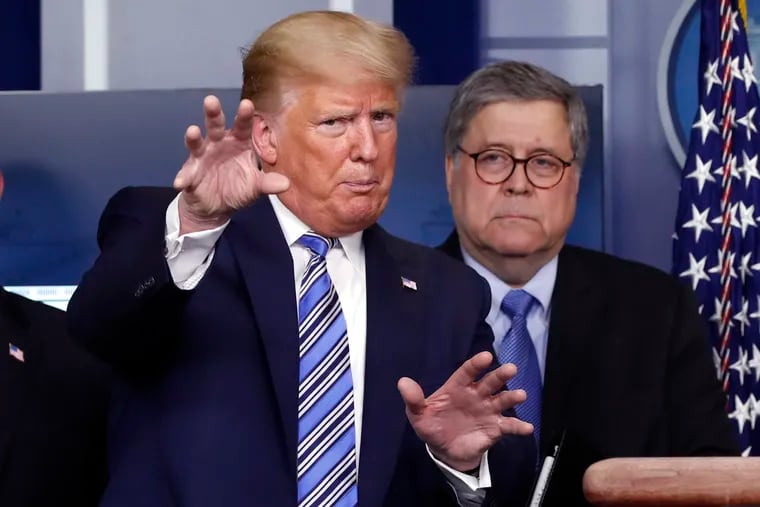President Donald Trump talks during a briefing about the coronavirus as Attorney General William Barr looks on in March.