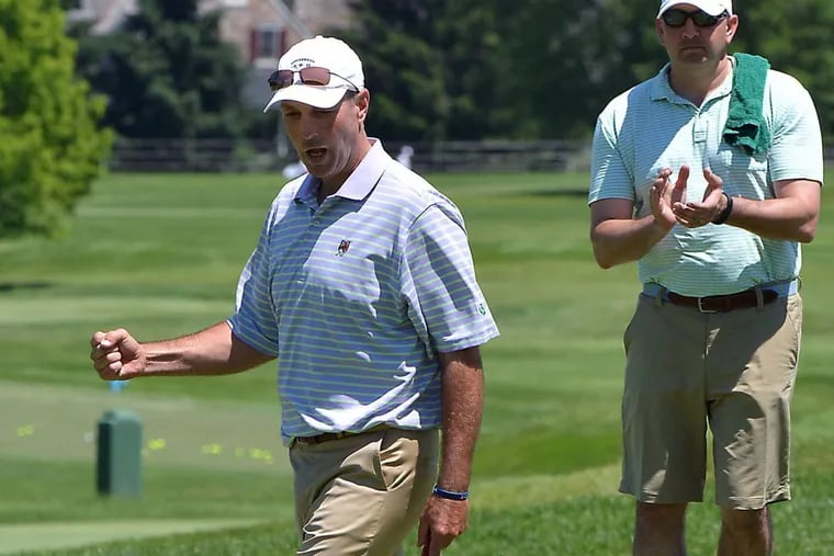 Dave McNabb (left) reacts to a shot during a May 2016 tournament.