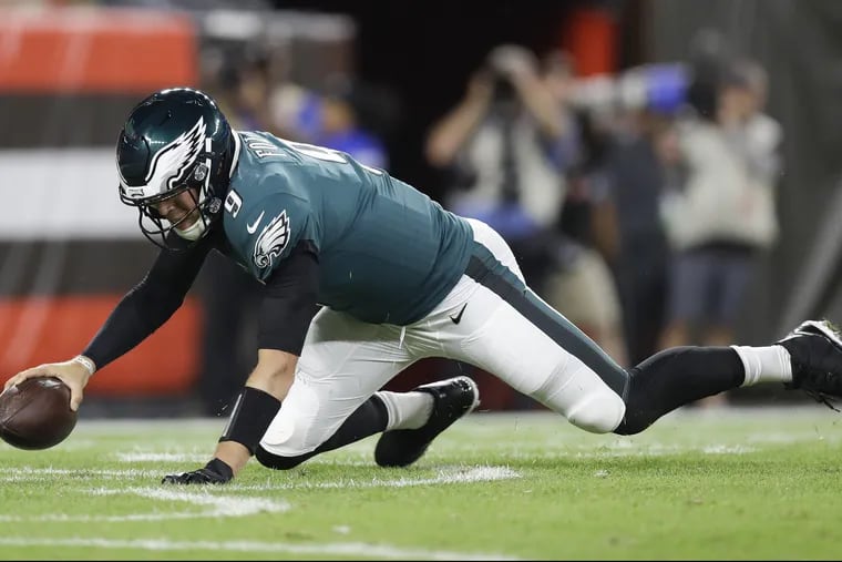 Eagles quarterback Nick Foles falls down resulting in a safety against the Cleveland Browns during a preseason game at FirstEnergy Stadium in Cleveland on Thursday, August 23, 2018.