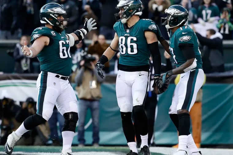 Zach Ertz (86) celebrates with Jason Kelce (62) and Alshon Jeffery (17) after one of his touchdown catches in the Philadelphia Eagles' 32-30 win over the Houston Texans at Lincoln Financial Field.