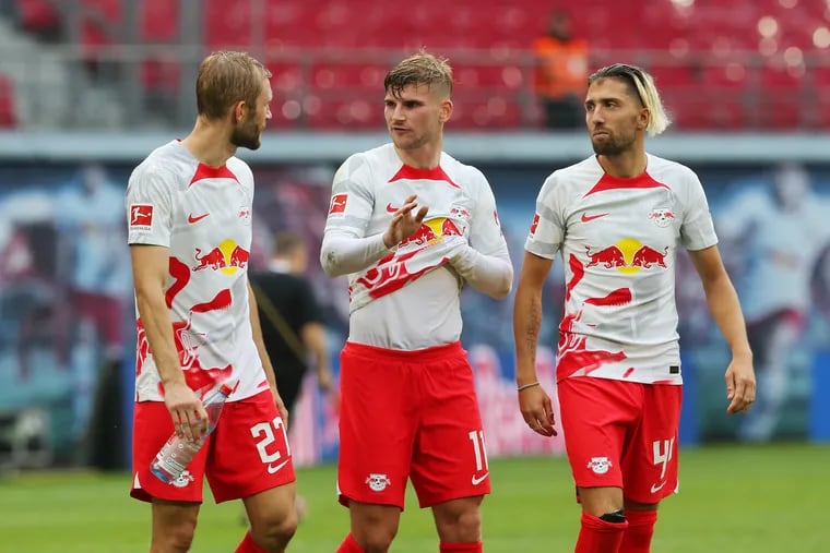 Konrad Laimer, Timo Werner and Kevin Kampl of RB Leipzig are seen following their side's victory in the Bundesliga match between RB Leipzig and VfL Wolfsburg at Red Bull Arena on August 27, 2022 in Leipzig, Germany. (Photo by Matthias Kern/Getty Images)