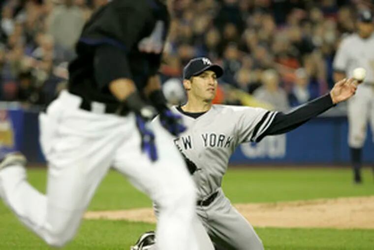 New York Yankees pitcher Andy Pettitte throws out the Mets&#0039; Carlos Gomez during the first inning. The Mets won, 3-2.