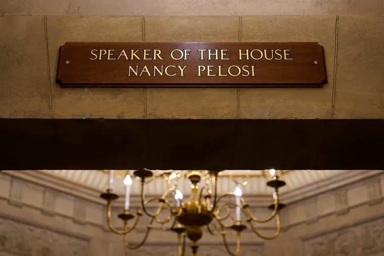 In this Jan.18, 2021 photo, a view of the new sign marking the office for House Speaker Nancy Pelosi of Calif., from inside the U.S. Capitol in Washington. The new sign replaces the one that was destroyed when rioters stormed the Capitol.