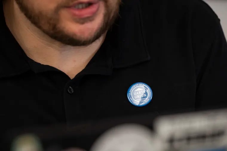 Bradley Philbert, an adjunct professor at University of the Arts, wears a union pin while he teaches a virtual summer class.
