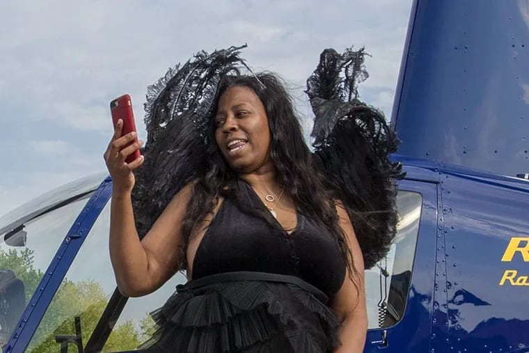 Saudia Shuler films her son and his date at a James Bond-style prom send-off on May 12, 2018. Shuler pleaded guily to federal fraud charges Tuesday tied to government disability payments she claimed while working full-time.