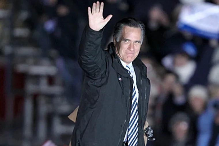 Gov. Mitt Romney waves to the crowd as he arrives at Shady Brook Farm in Yardley, PA. for a campaign rally. Thousands braved the cold for hours just 2 days before the Presidential election. (Charles Fox / Staff Photographer)