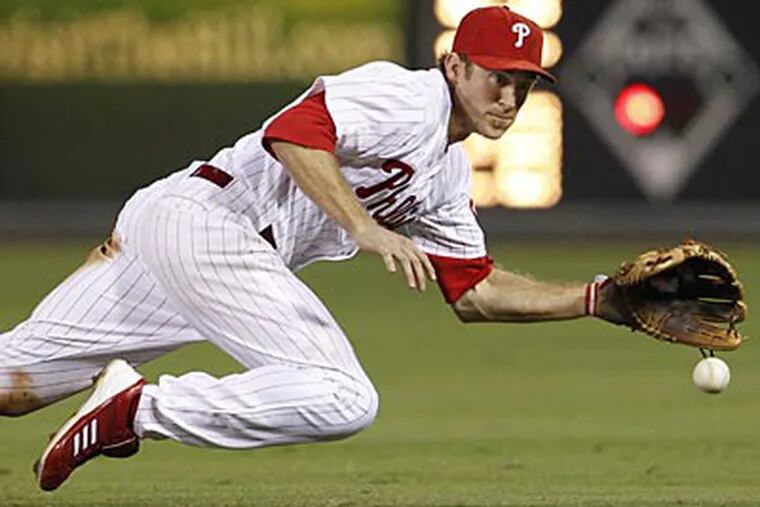 Chase Utley took ground balls at third base before Wednesday's game against the Mets. (Ron Cortes/Staff file photo)