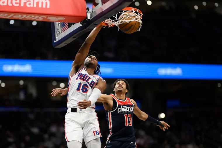 Sixers guard Ricky Council IV dunks against the Wizards' Jordan Poole on Saturday.