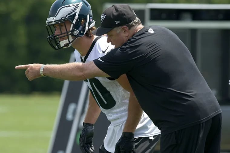 Linebacker Kiko Alonso gets instruction from position coach Rich Mintor. (Clem Murray/Staff Photographer)