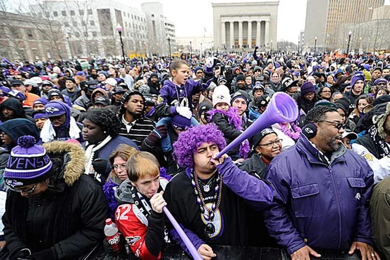 The 75,000 fans who had waited patiently and noisily for hours to greet Joe Flacco and the new NFL champions screamed madly at the sight of the lanky quarterback. (Gail Burton/AP)