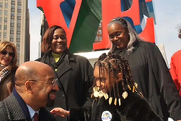 Mayor Nutter thanks Destiny Hill, 7, a first grader at Henry C. Lea Elementary School who introduced him at a news conference in LOVE Park. Behind them are (from left) Girard Estates leader Elaine Fera, city constituent services assistant Vernice Bradley, and Streets Commissioner Clarena Tolson.