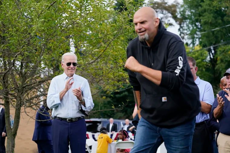 President Joe Biden watches as Democratic Pa. Lt. Gov. John Fetterman takes the stage at an event in West Mifflin last month.