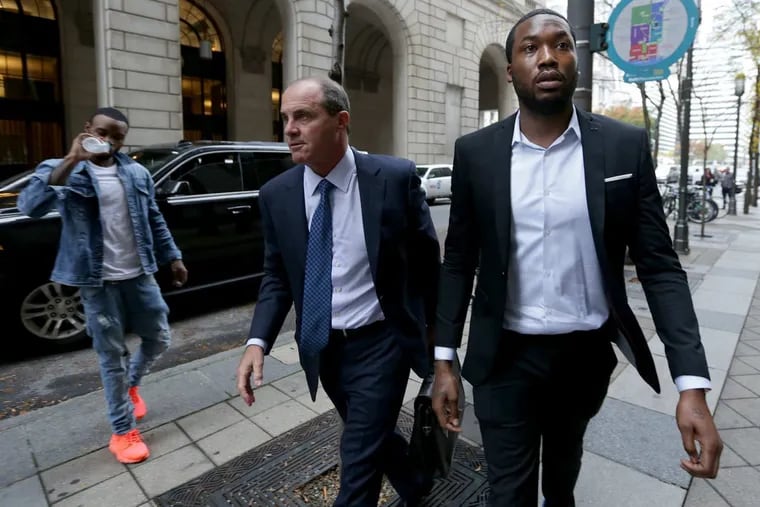 Rapper Meek Mill, right, arrives the Criminal Justice Center with his lawyer Brian McMonagle, center, in Philadelphia, PA on November 6, 2017.