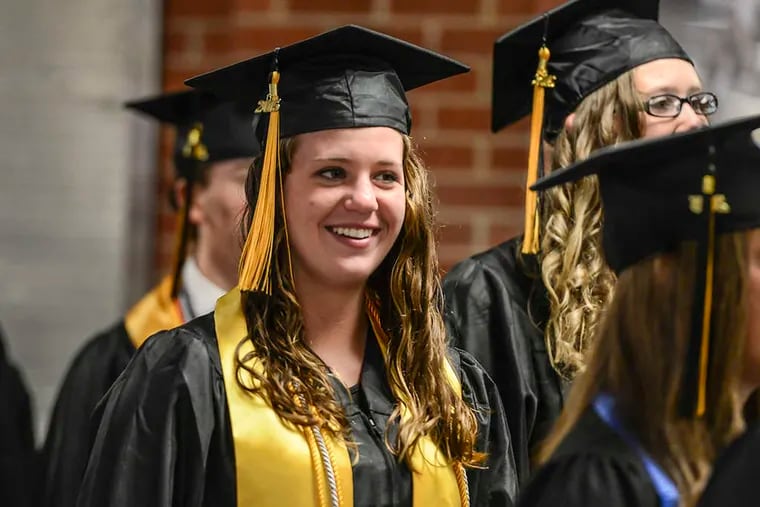ASSOCIATED PRESS Just looking to make sure the smile continues after graduation.