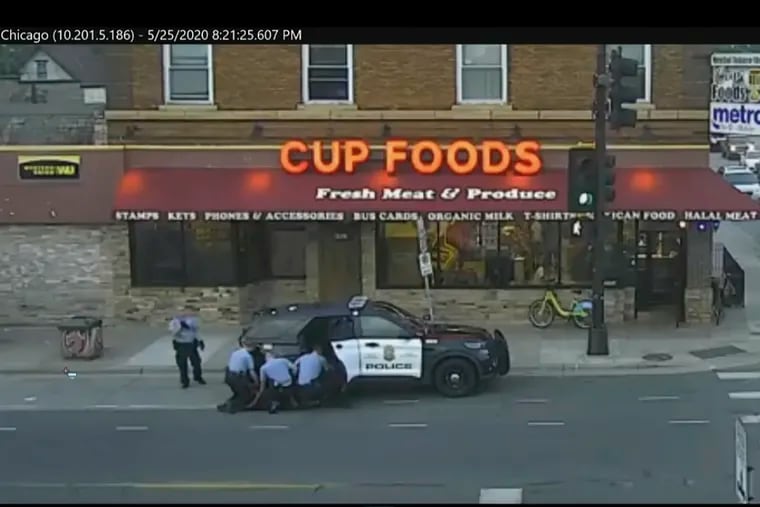 In this May 25, 2020 image from surveillance video, Minneapolis police officers from left, Tou Thao, Derek Chauvin, J. Alexander Kueng and Thomas Lane are seen attempting to take George Floyd into custody in Minneapolis.