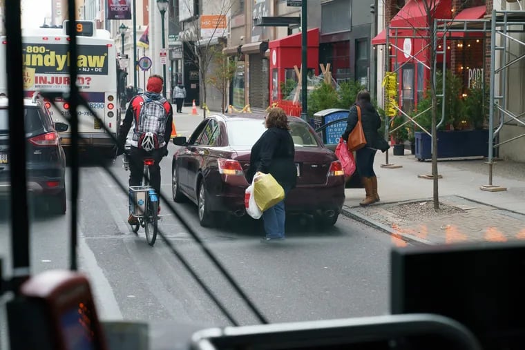 A shopper stopped their car in the bus lane on the 1200 block of Chestnut Street blocking a Route 21 bus in December 2018.
