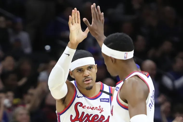 Tobias Harris, left, and Josh Richardson of the Sixers high-five during their game against the Knicks at the Wells Fargo Center on Feb. 27, 2020.