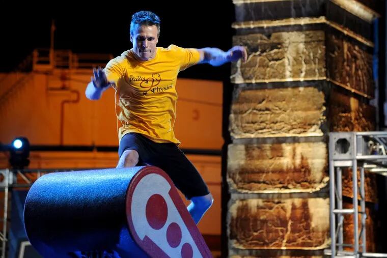 Rich “the Philly Physician” Shoemaker of Roxborough takes a leap onto the “Floating Steps,” the first obstacle in the 2016 ‘American Ninja Warrior’ obstacle course.