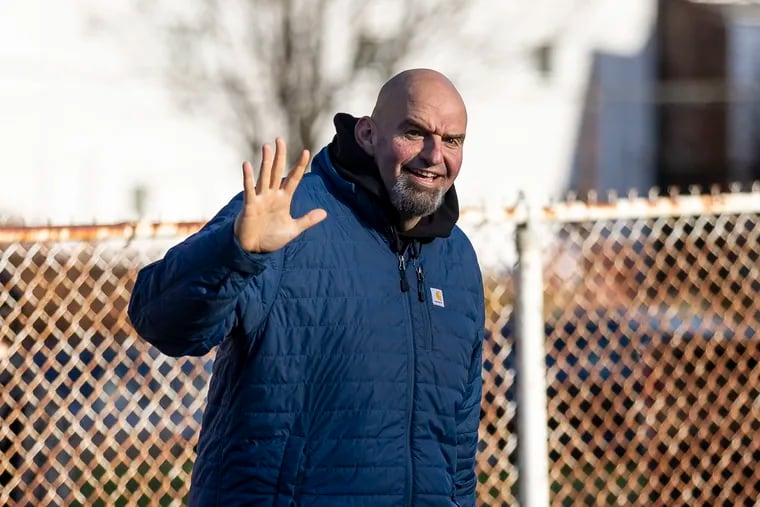 John Fetterman, and his wife Gisele Barreto Fetterman, arrive at New Hope Multi Center to to vote for the elections in Braddock, Pa., on Tuesday, Nov. 8, 2022.