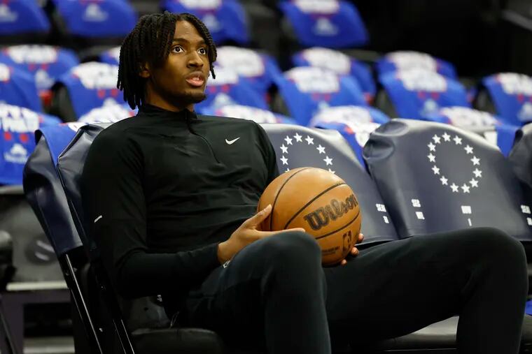 Sixers guard Tyrese Maxey watches his teammates warm up before the Sixers play the New York Knicks in Game 6 of their first-round series.