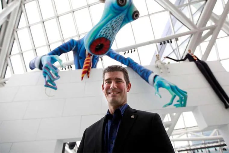 Bucks native Greg Harris, named CEO in December, at the Rock and Roll Hall with Pink Floyd creatures.