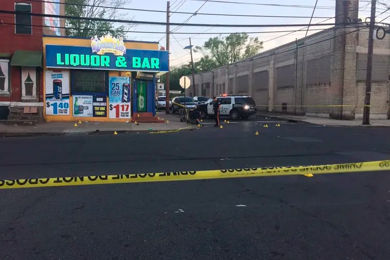 This photo provided by 3 CBS Philadelphia shows police canvasing the scene of a shooting in Trenton, N.J. on Saturday, May 25, 2019.  New Jersey police say 10 people have been wounded following a shooting at a Trenton bar.  Trenton police spokesman Capt. Stephen Varn said five men and five women were transported to local hospitals. He said one victim was critically wounded and taken into emergency surgery.