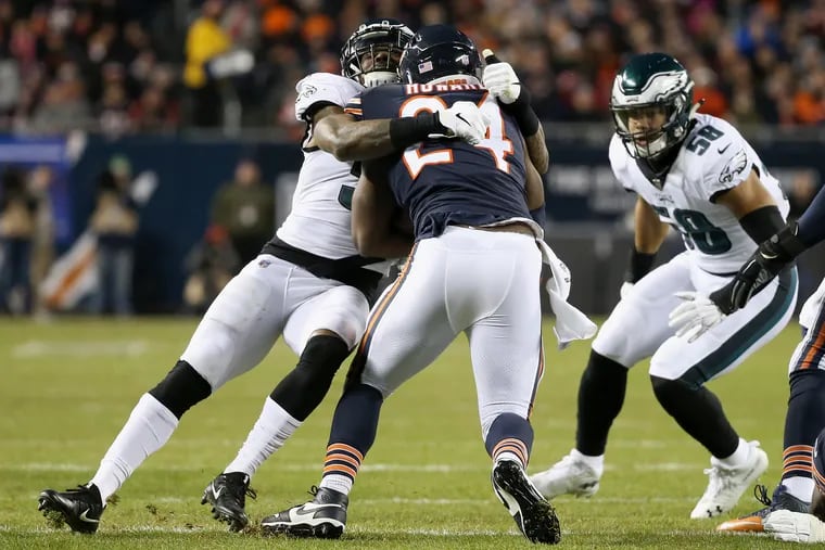 Eagles linebacker Nigel Bradham (53) tackles Chicago Bears running back Jordan Howard (24) during a first-round playoff game at Soldier Field in Chicago on Sunday, Jan. 6, 2019.