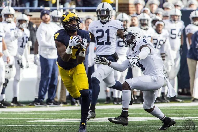 Michigan wide receiver Nico Collins, left, makes a 47-yard reception, defended by Penn State safety Nick Scott (4) in the second quarter of an NCAA college football game in Ann Arbor, Mich., Saturday, Nov. 3, 2018.