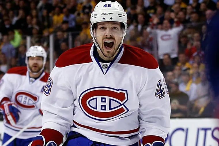Canadiens center Daniel Briere (48) celebrates Dale Weise's goal against the Boston Bruins during the first period in Game 7 of an NHL hockey second-round playoff series in Boston, Wednesday, May 14, 2014. (Elise Amendola/AP)