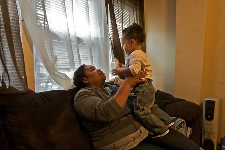 Single parent Angela Sutton plays with her son Ayaan, 1. According to a report released todayby Women&#0039;s Way, more than one in three families headed by single mothers live in poverty.