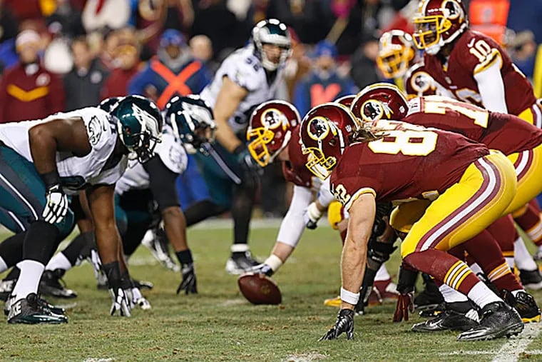 Redskins offensive players line up against the  Eagles defense. (Geoff Burke/USA Today Sports)