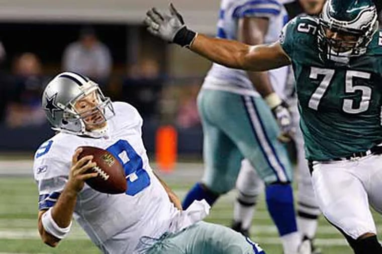 Eagles' Juqua Parker sacks Cowboys QB Tony Romo during last season. (Ron Cortes / Staff Photographer)