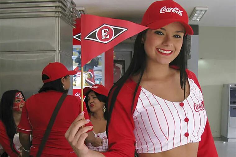 A cheerleader for Leones del Escogido. No one can quite say why the country is such a baseball factory.
