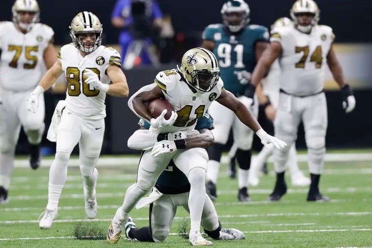 New Orleans Saints running back Alvin Kamara runs with the football against Eagles strong safety Malcolm Jenkins on Sunday, November 18, 2018 in New Orleans.