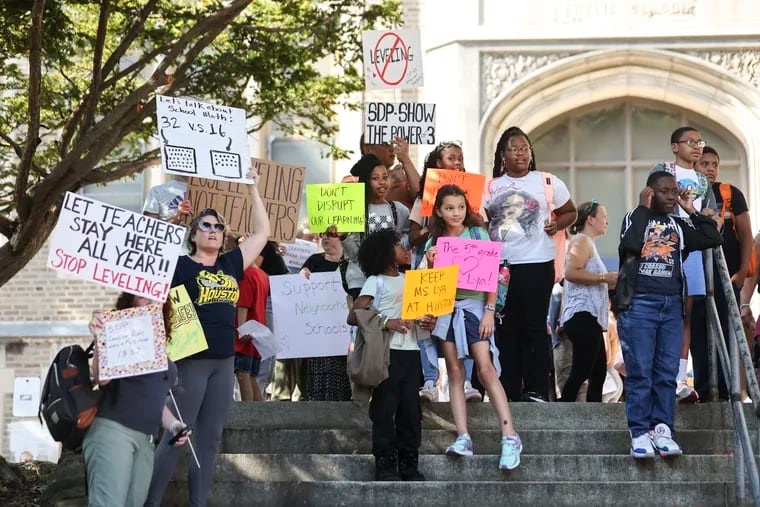 Parents, students and supporters gathered outside of Henry Houston Elementary in opposition of the practice of “leveling” in Philadelphia on Wednesday.