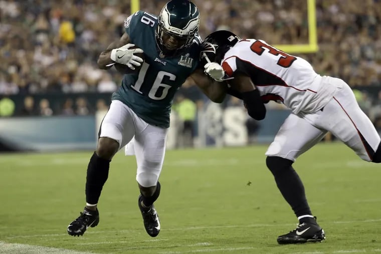 Philadelphia Eagles' DeAndre Carter (16) is tackled by Atlanta Falcons' Brian Poole (34) during the first half of an NFL football game, Thursday, Sept. 6, 2018, in Philadelphia. (AP Photo/Matt Rourke)